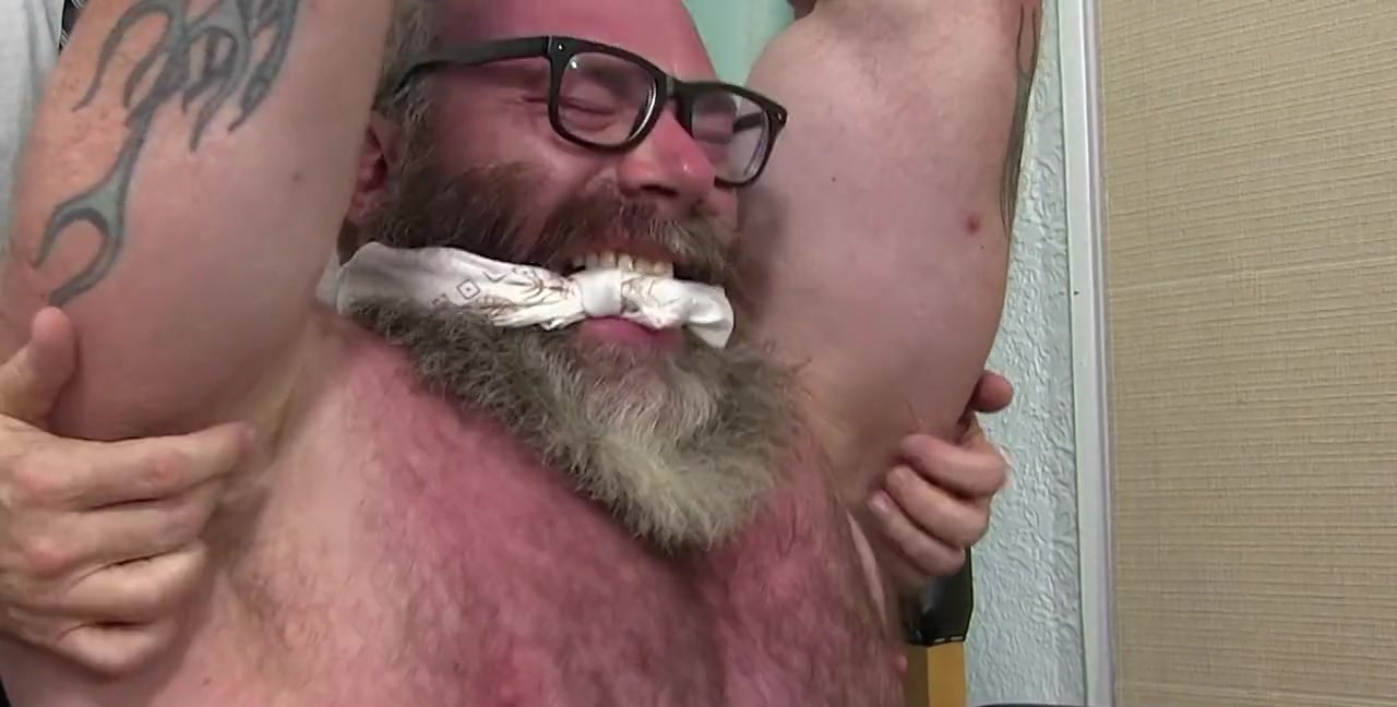 Old muscular guy with a bear tied up and tickled by a pervert